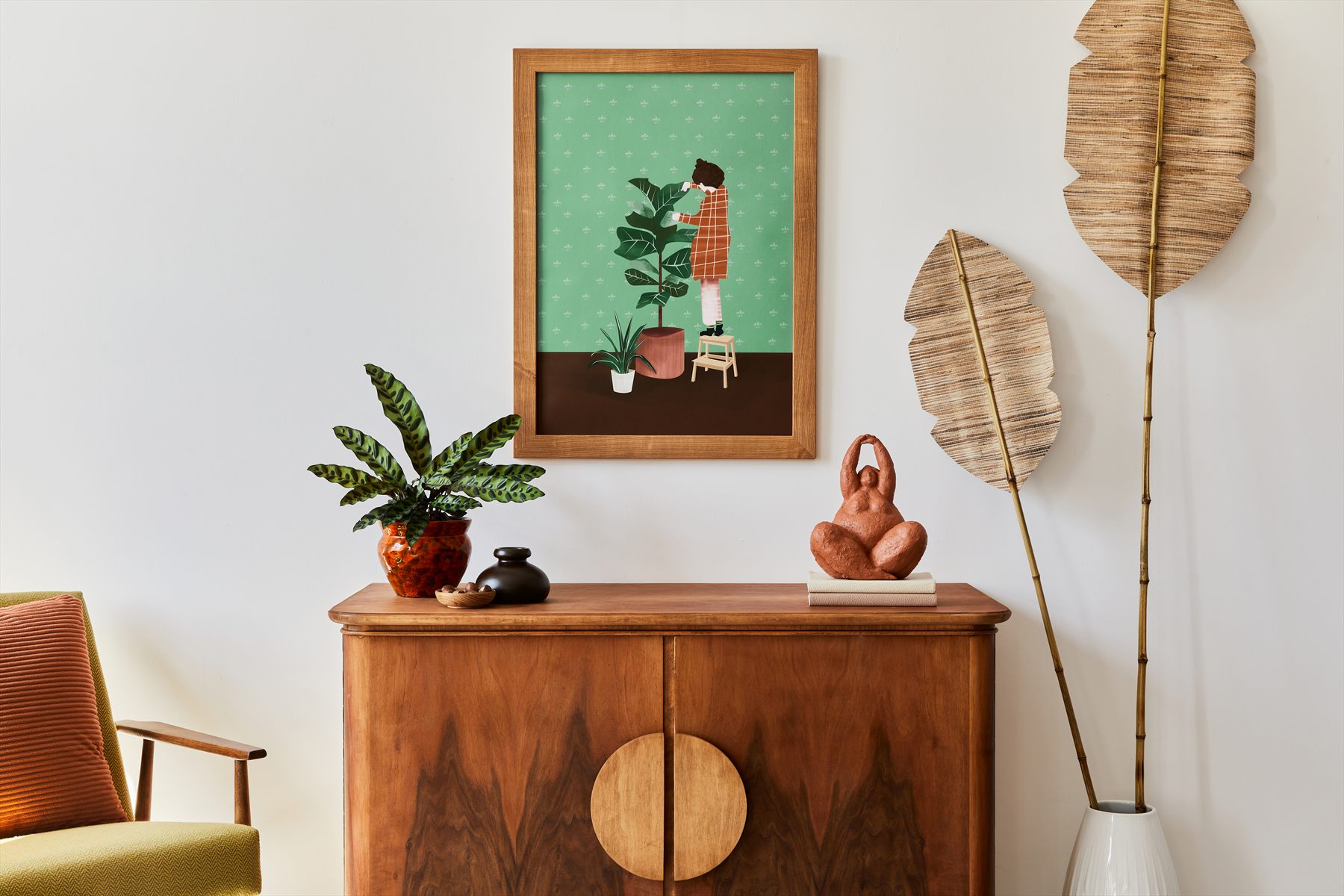 A warm interior with plants, wood furniture, and framed art, suggesting a quiet place to return to the guide and reflect.